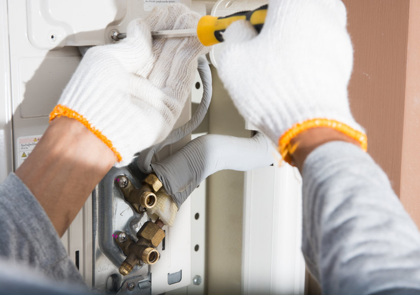 preparing to install new air conditioner and wear gloves